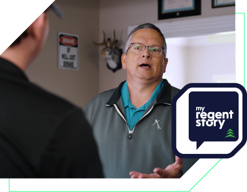 a picture of Doctor Robert Zoellner holding a pen signing a document